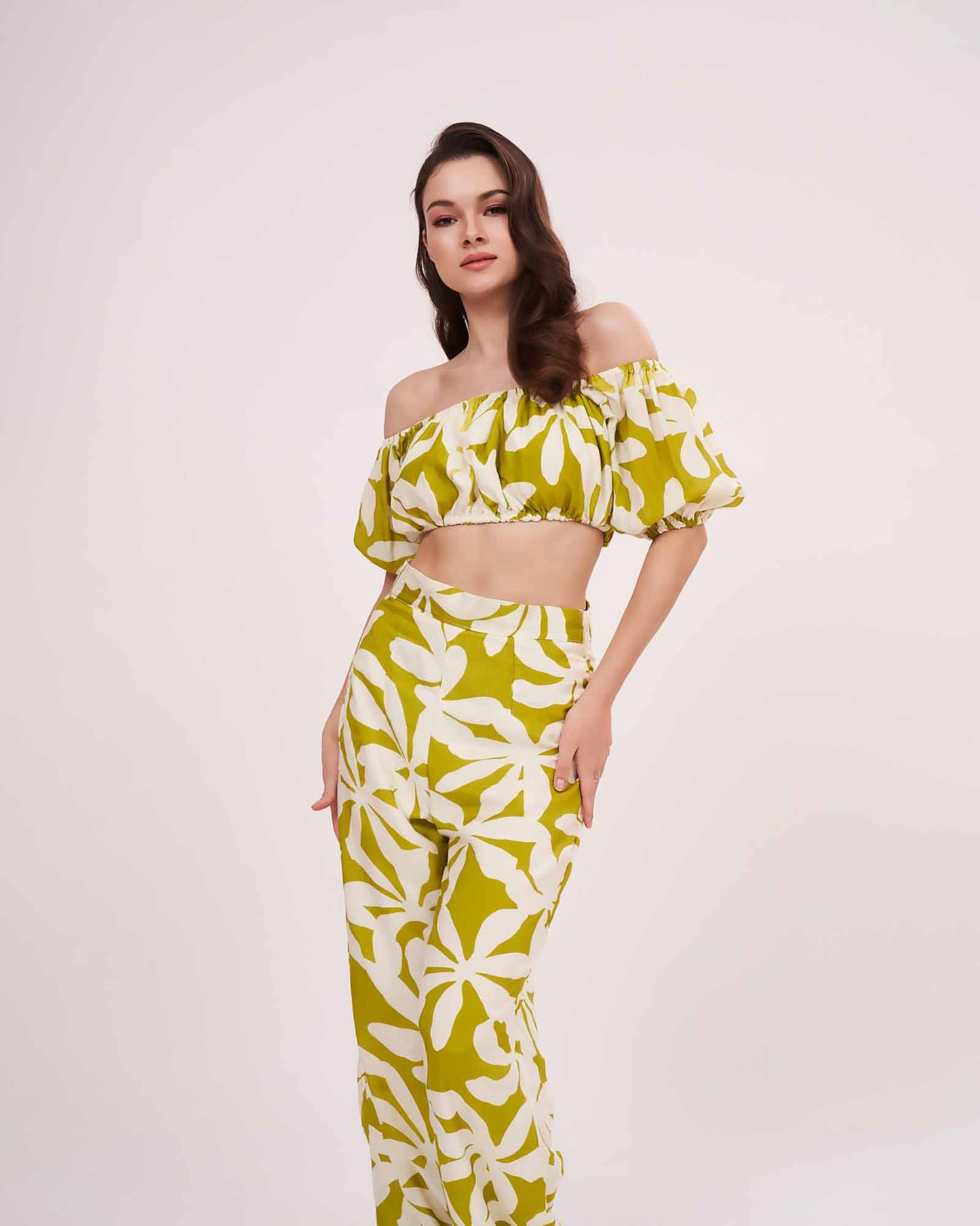 Model in a full standing pose facing forward, displaying the complete set with matching printed trousers and off-shoulder crop top