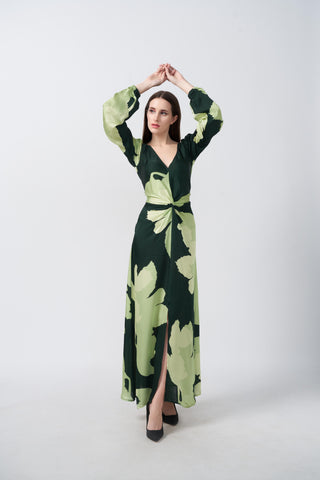 Long-sleeve maxi dress featuring a deep V-neckline and a central twisted knot detail at the waist that creates a flattering draped effect.