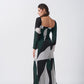 Back view of model wearing the crepe dress, showing the fall and structure of the long-sleeved silhouette.