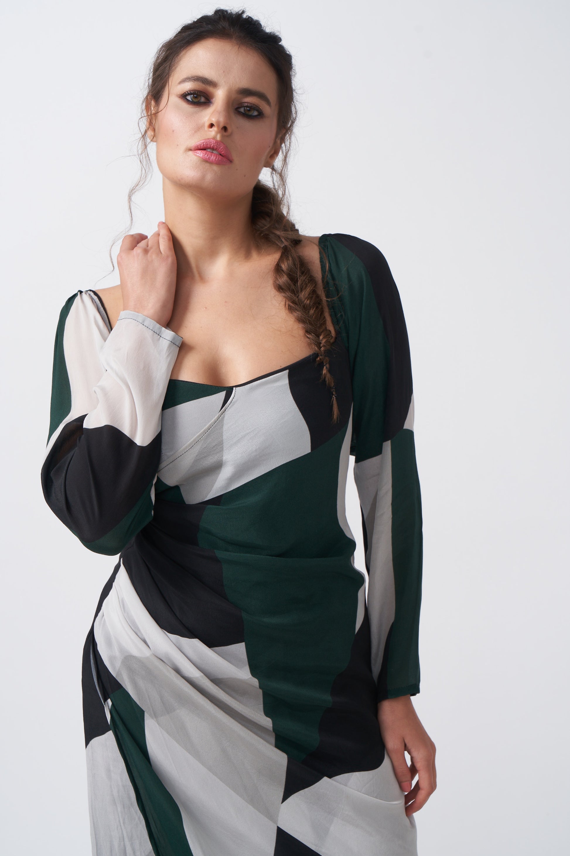 Close-up front view emphasizing square neckline and shoulder detailing of the abstract dress.
