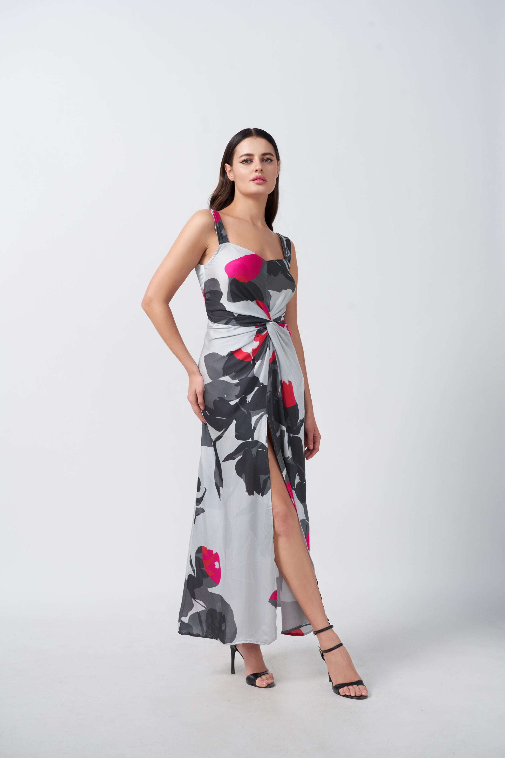 Model standing in grey and white floral satin dress showing full silhouette and ankle length.