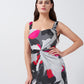 Close-up view of the satin dress showing pink front knot detail and neckline.