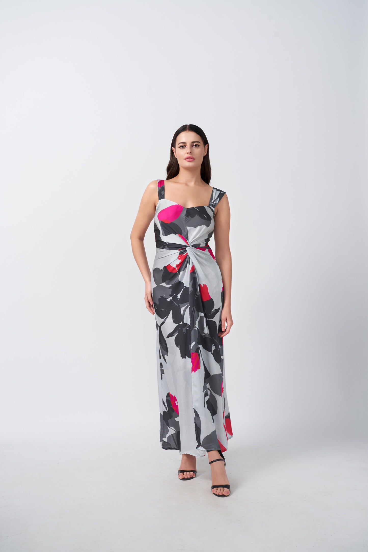 Front-facing view of model in grey and white abstract satin dress with pink-accented front knot.