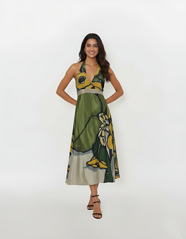 Halter-neck midi dress featuring a bold floral abstract print in earthy green, mustard yellow, grey, and black tones.