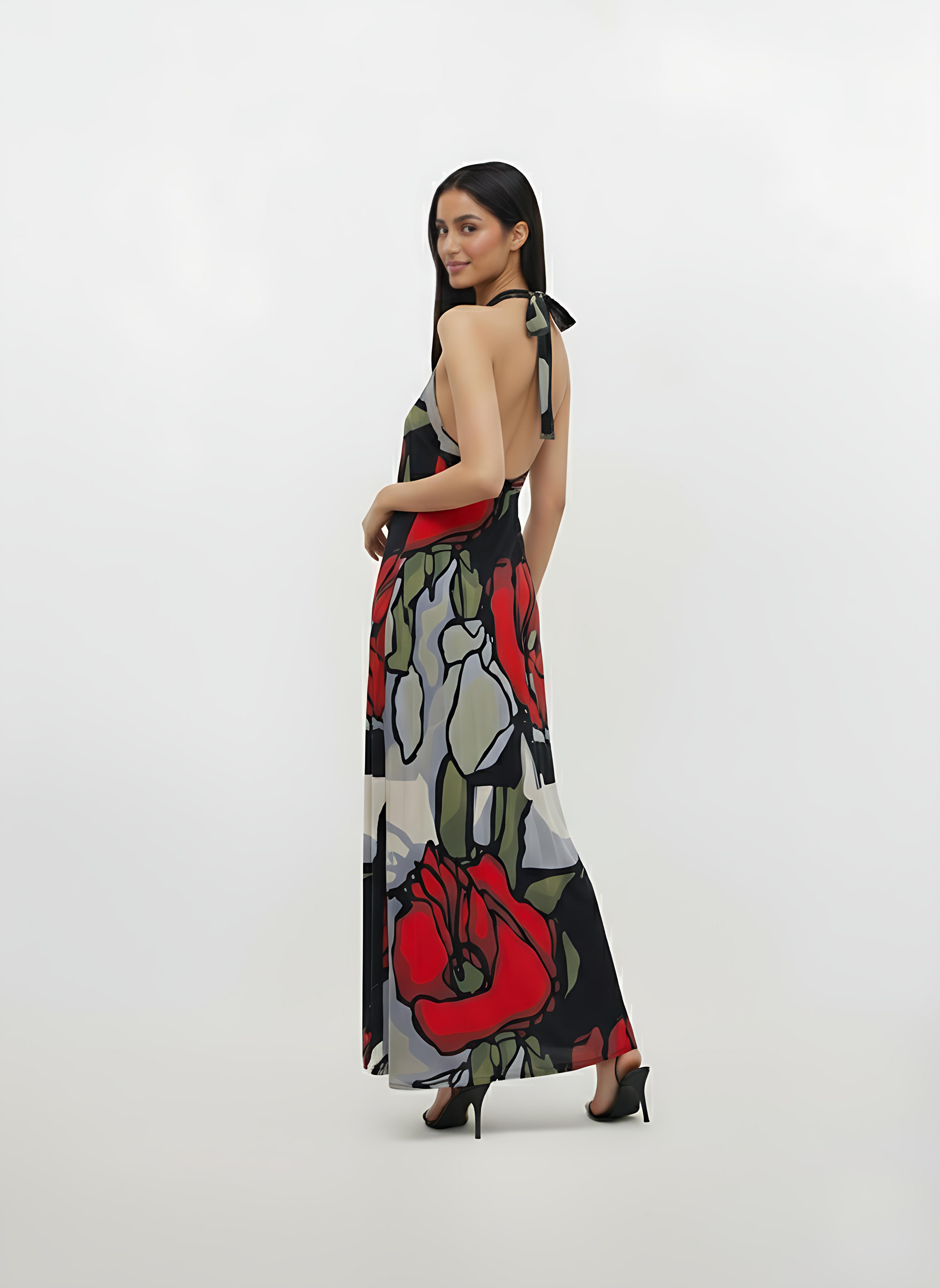 Backless long-line dress crafted from a lightweight, breathable fabric with thin straps, designed for graceful movement at the hem.