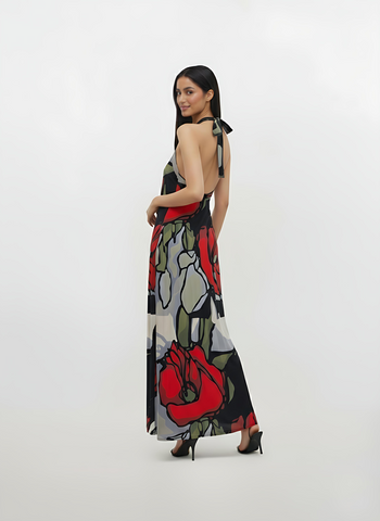 Backless long-line dress crafted from a lightweight, breathable fabric with thin straps, designed for graceful movement at the hem.