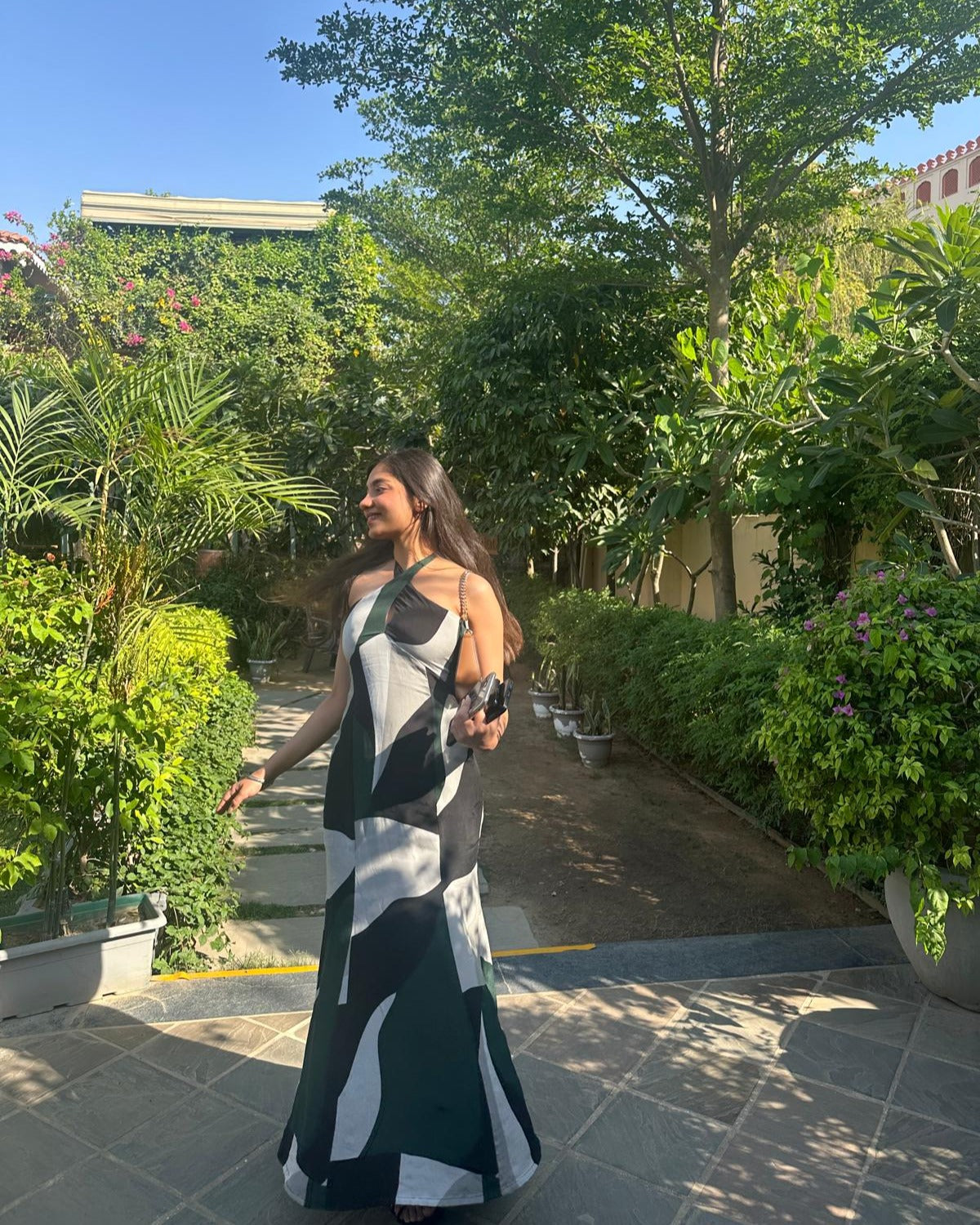 Green and grey abstract print crepe dress with a tie-back halter, ideal for high-end events and elegant occasions