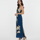 Ankle-length crepe dress with a halter tie-back neckline and keyhole detail, featuring a navy blue and beige abstract floral print with olive and cream accents, suitable for refined evening occasions