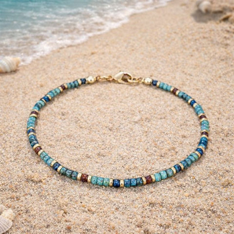 A handcrafted multicolour stone beaded anklet with gold-toned accents, an essential accessory for summer festivals, beach parties, or everyday boho-chic styling.