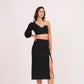 Elegant high-waisted black muslin skirt with thigh-high slit, offering sophistication and glamour for chic occasions