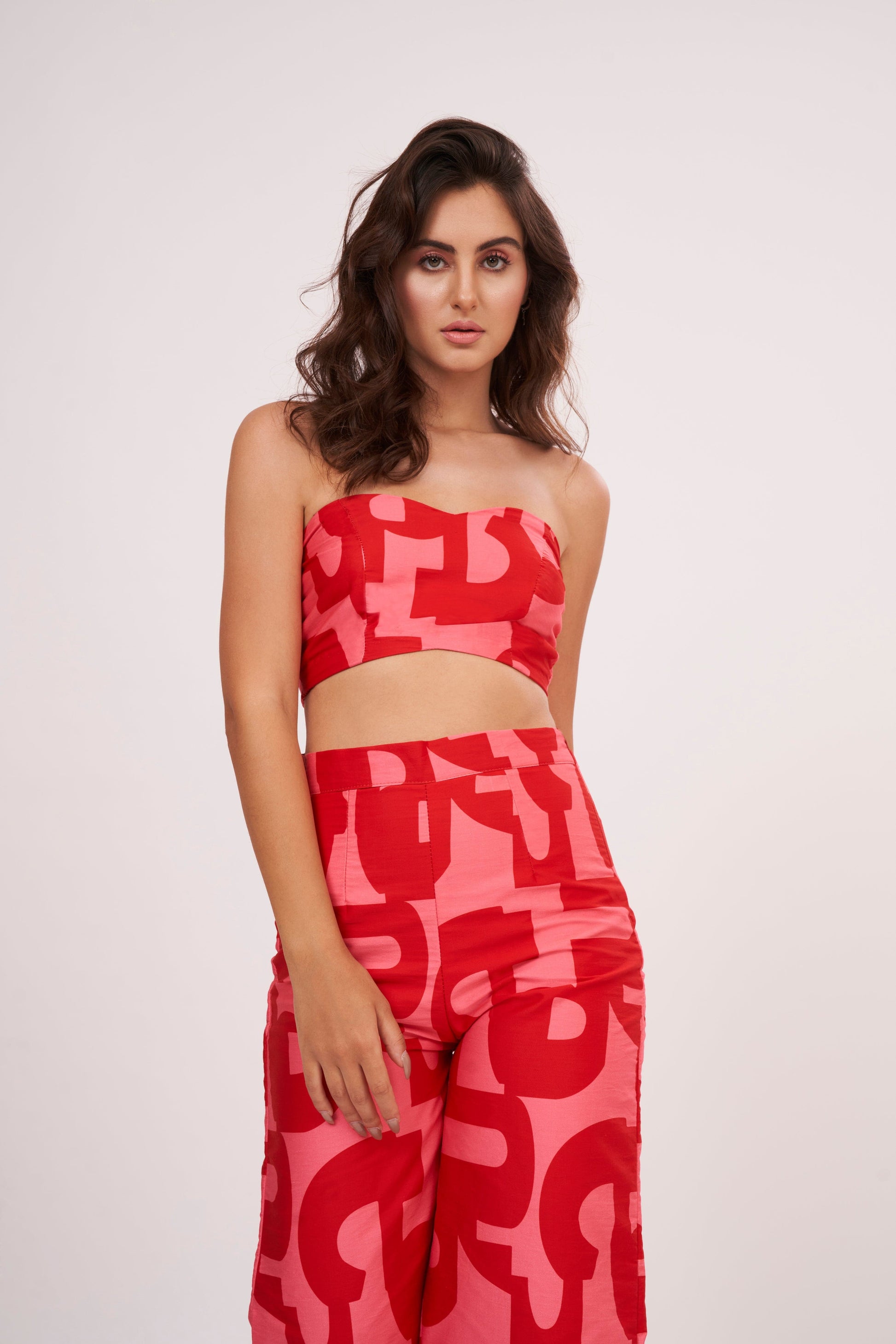 Red Co Ord tube crop top in lightweight cotton satin, featuring pink-red geometric print. Snug yet comfortable fit flatters the figure, perfect for summer days.