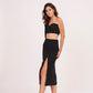 Elegant high-waisted black muslin skirt with thigh-high slit, offering sophistication and glamour for chic occasions