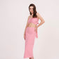 Tie-back crop top with ruched design and delicate pink hue. Ideal for any occasion. Can be paired with matching skirt or mixed and matched for a unique look.
