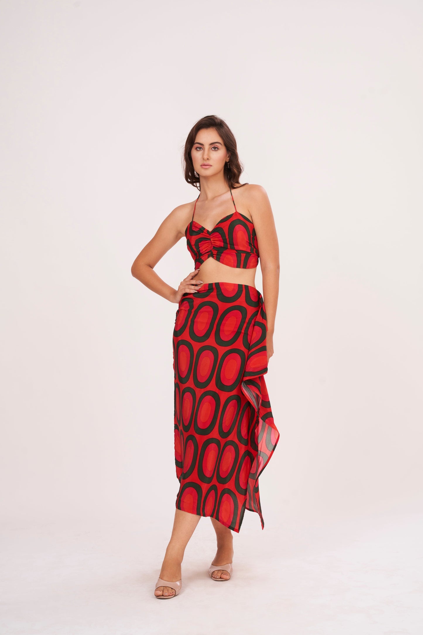 A stunning long skirt with a slit and cascading ruffles, offering a flirty and fun look while accentuating the silhouette, made from high-quality crepe.