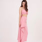 Tie-back crop top with ruched design and delicate pink hue. Ideal for any occasion. Can be paired with matching skirt or mixed and matched for a unique look.