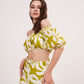 Green geometric print, loose-fit, wide-legged flowy trousers perfect for a breezy, relaxed feel during summer.