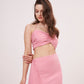 Tie-back crop top with ruched design and delicate pink hue. Ideal for any occasion. Can be paired with matching skirt or mixed and matched for a unique look.