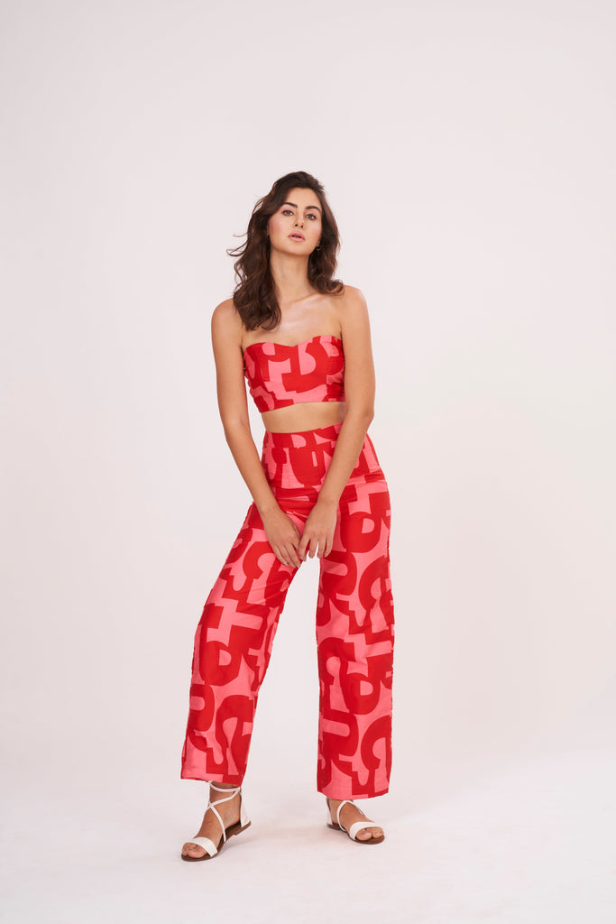 Pink-red geometric print Palazzo pants in lightweight cotton satin. Perfect for summer, mix and match for distinct looks.