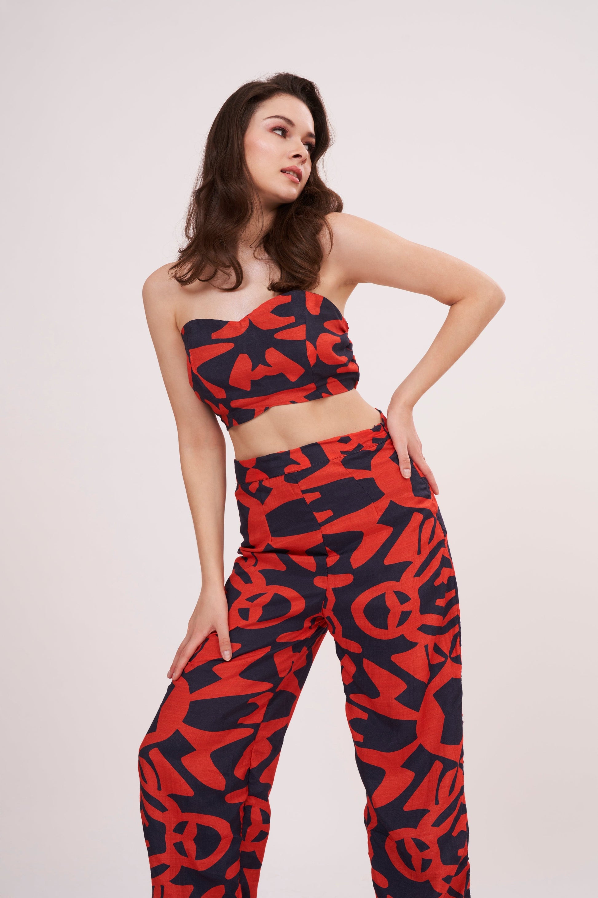 Stylish and comfortable parallel trousers with bold geometric design, crafted from premium muslin fabric, featuring a roomy, flowy silhouette and vibrant colors.