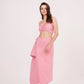 Tie-back crop top with ruched design and delicate pink hue. Ideal for any occasion. Can be paired with matching skirt or mixed and matched for a unique look.