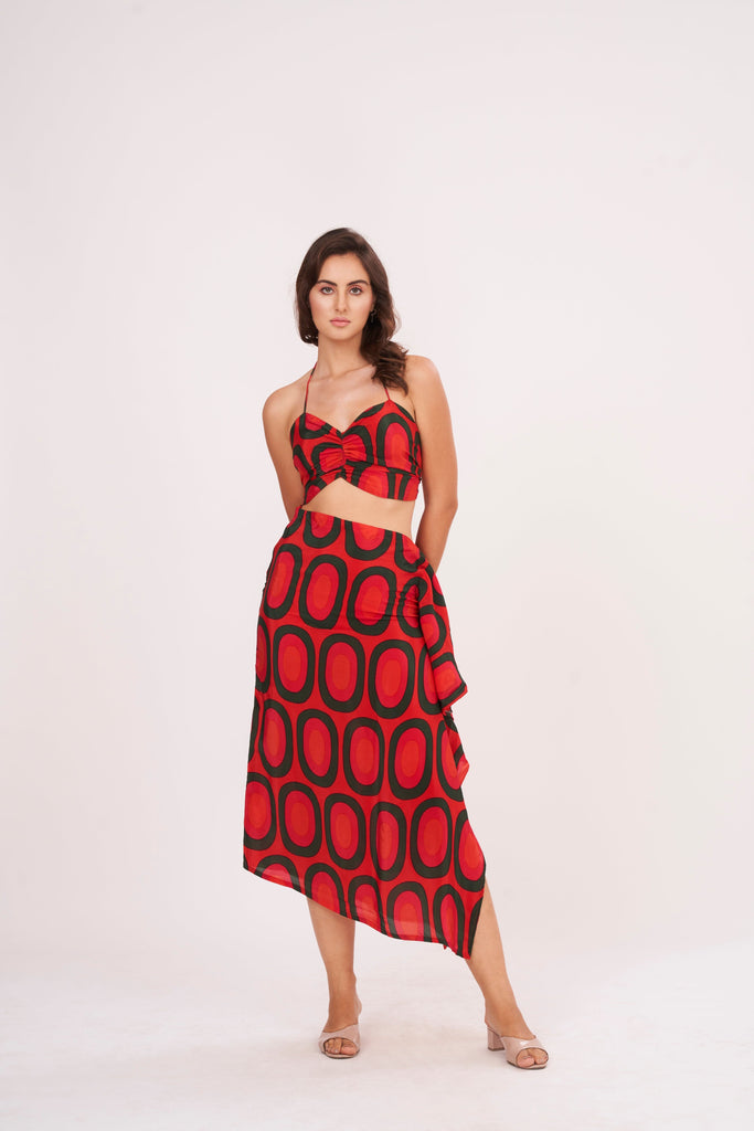 A stunning long skirt with a slit and cascading ruffles, offering a flirty and fun look while accentuating the silhouette, made from high-quality crepe.