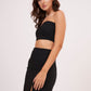 Elegant high-waisted black muslin skirt with thigh-high slit, offering sophistication and glamour for chic occasions