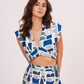 Image of a printed crop top from Designer Co Ord Set made from premium muslin fabric. Trendy v-neck and bold geometric design in vibrant colors.
