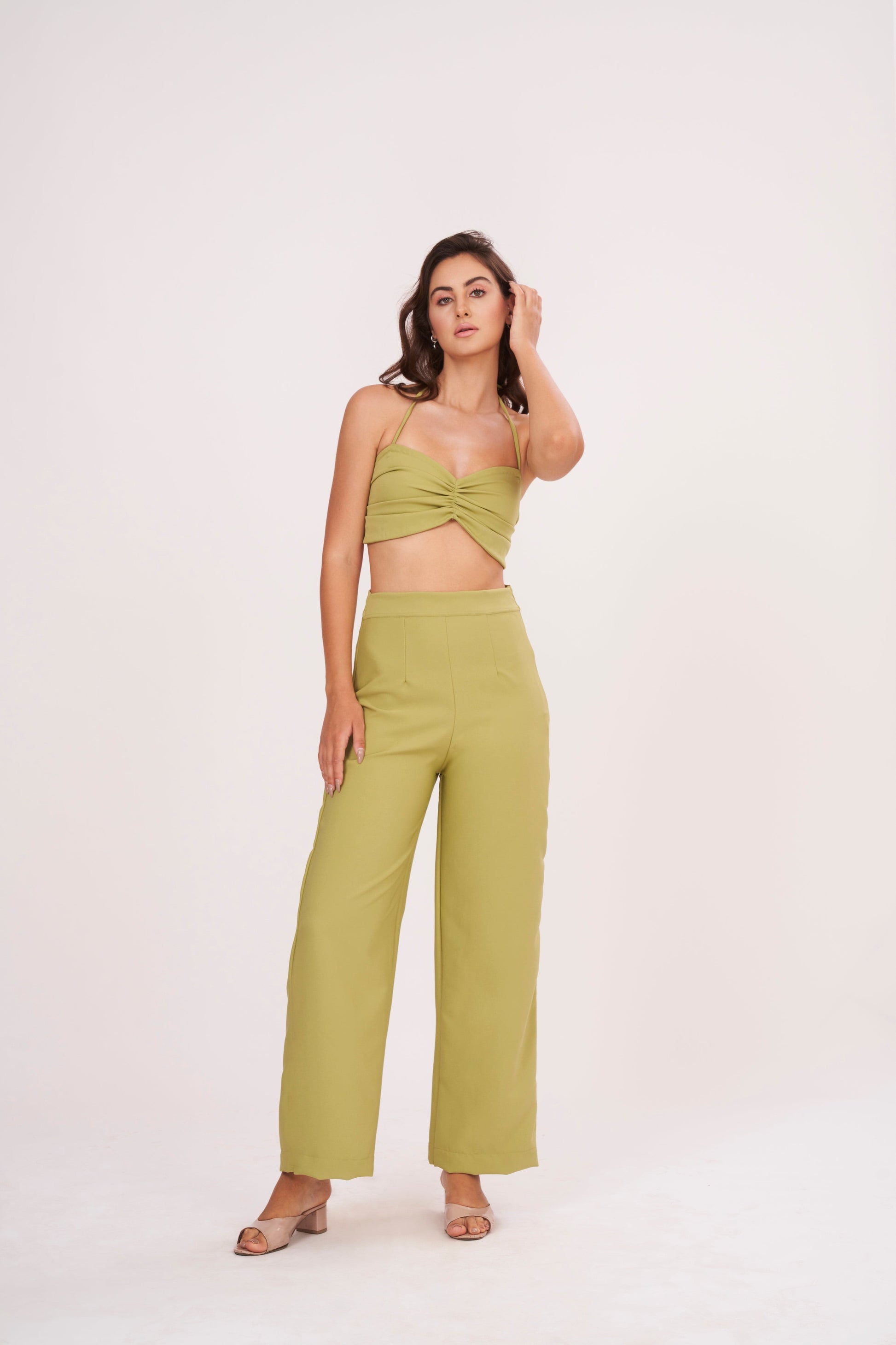 Elegant green halter neck bralette with ruched detailing and tie-up closure, part of a chic co-ord set for confidence and style.