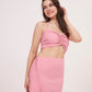 Tie-back crop top with ruched design and delicate pink hue. Ideal for any occasion. Can be paired with matching skirt or mixed and matched for a unique look.