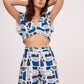 Image of a printed crop top from Designer Co Ord Set made from premium muslin fabric. Trendy v-neck and bold geometric design in vibrant colors.
