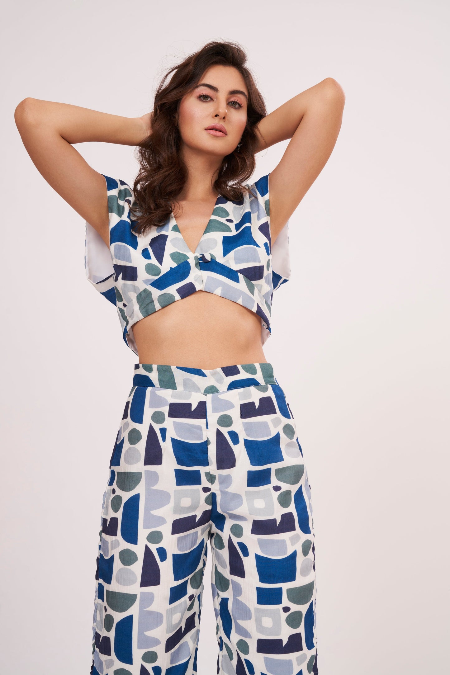 Image of a printed crop top from Designer Co Ord Set made from premium muslin fabric. Trendy v-neck and bold geometric design in vibrant colors.