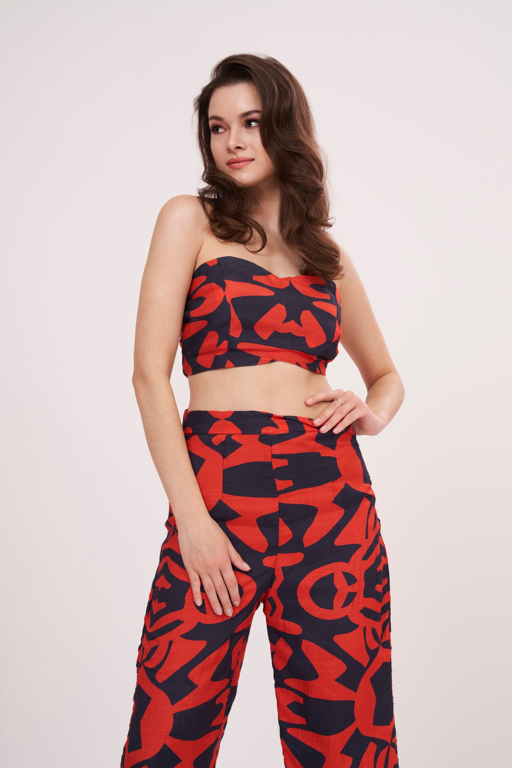 Stylish and comfortable parallel trousers with bold geometric design, crafted from premium muslin fabric, featuring a roomy, flowy silhouette and vibrant colors.
