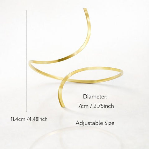 A sophisticated gold open-cuff anklet featuring a thick, sculpted metal design with a high-shine finish, perfect for adding a touch of modern luxury to a formal gala or a high-end resort look.
