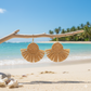 Natural-style brown rattan drop earrings featuring a woven round centre and fan-shaped drop, suitable for relaxed outings and daytime occasions.