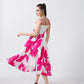 Back view capturing the dress in a twirl, demonstrating the airy movement and soft drape of the lightweight crepe fabric.