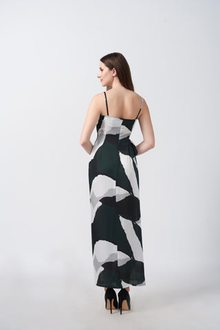 Back view of an ankle-length satin wrap dress with spaghetti straps and flowing silhouette