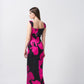 Back view of a pink and black floral satin ankle-length dress with shoulder straps and a smooth drape