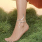 This polished silver sculpted anklet showcases a contemporary "no-clasp" design, making it a versatile and effortless accessory for elevating your wardrobe for a sophisticated holiday look.