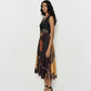 Sleeveless V-neck midi dress with a structured waist and abstract patchwork pattern in earthy tones