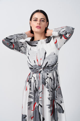 Long-sleeve satin midi dress with a refined floral pattern and fluid drape