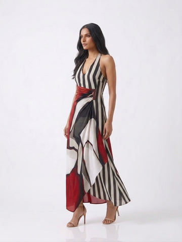 Bold monochrome striped maxi dress accented with a crimson red abstract panel