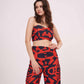 Model in multicolor printed co-ord set with sweetheart neck crop top and parallel pants, standing front-facing with arms relaxed.