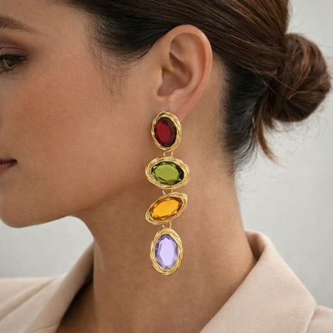 These elegant glass drop earrings catch the light beautifully, framing the face with a mix of colorful jewel tones that make them an ideal statement piece for a chic dinner party or a festive evening out.