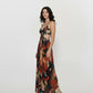 Halter neck maxi dress featuring a mosaic abstract print and flowing silhouette