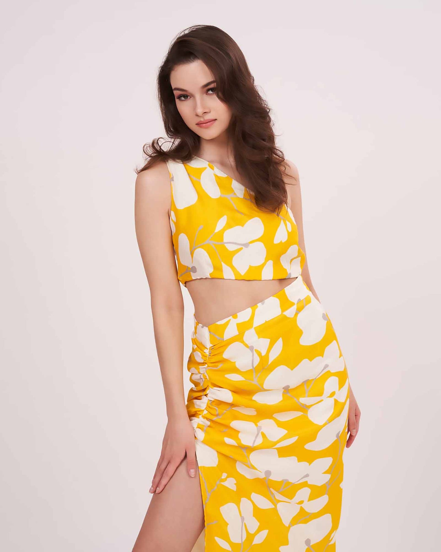 Muslin co-ord set featuring a yellow printed one-shoulder top paired with a matching skirt