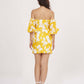 Rear view of the yellow muslin dress showing back zip closure, elasticated puff sleeves, and shoulder cut.