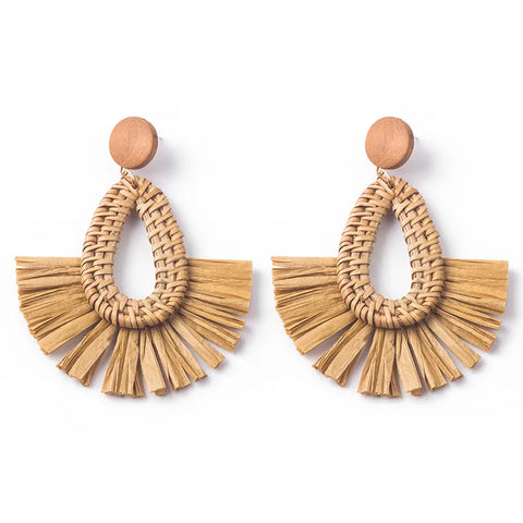 Pair of brown Rattan Geometric Earrings featuring a woven teardrop center and fanned raffia trim