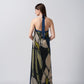 Back view of the model in navy blue and beige abstract floral halter dress, highlighting the tie-back detail and elegant drape.