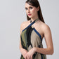 Close-up of the model in navy blue and beige halter neck dress, focusing on neckline and print.