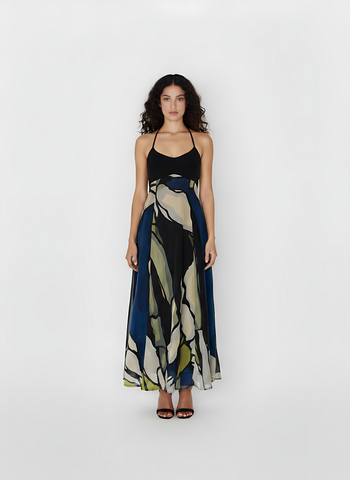 Ankle-length halter dress crafted from lightweight crepe, featuring a flowing silhouette and a navy blue and olive abstract floral print.